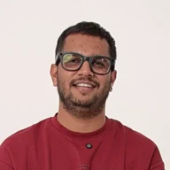 Bhavik Sarkhedi smiling in a studio portrait on a white background